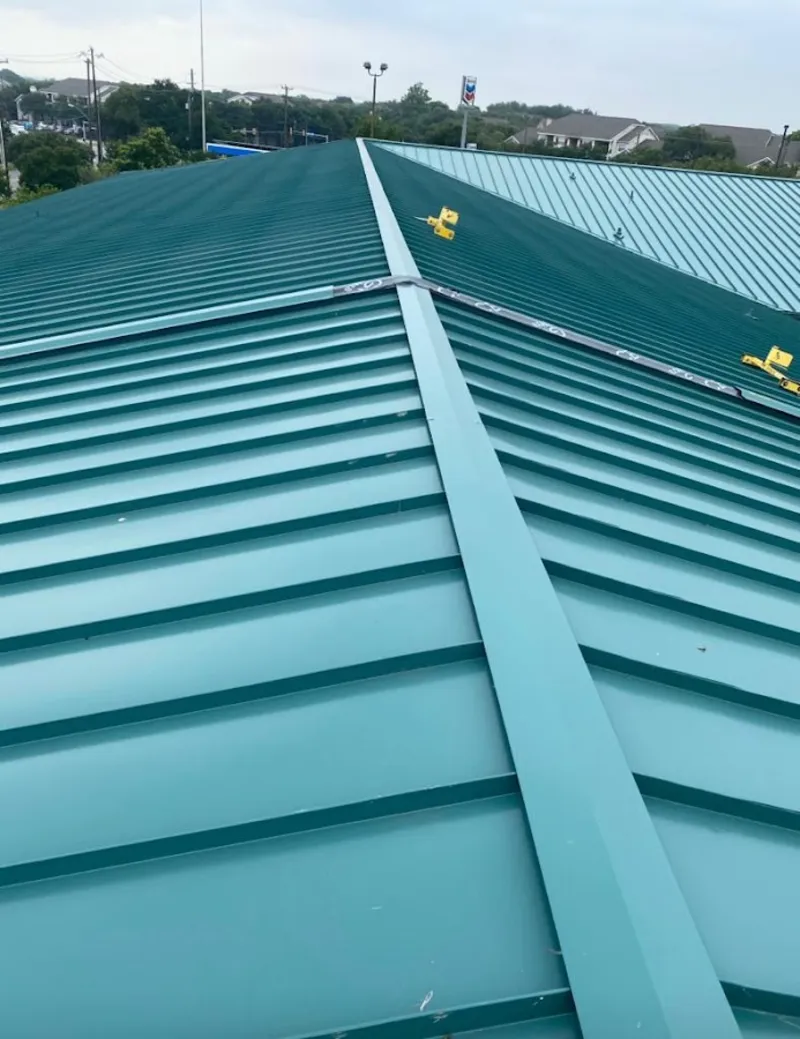 Green commercial metal roof ridge and valley for Metal Roof Repair in Cape Girardeau